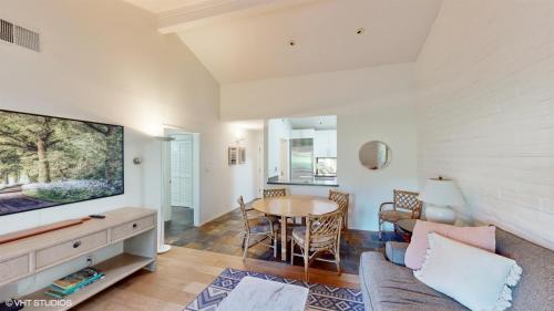 a living room with a couch and a table at Silverado Golf Course View Property in Napa