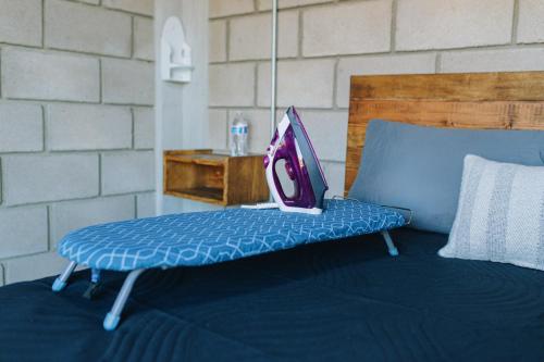 a bed with a laptop sitting on top of it at House Terravid in Ensenada