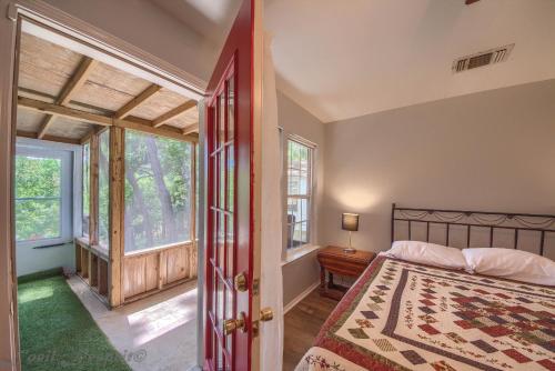 a bedroom with a bed and a window at Guadalupe Retreat RR 1324 in New Braunfels