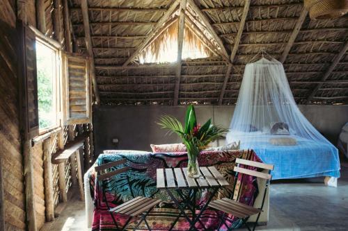 Postel nebo postele na pokoji v ubytování Bungalows India, El Valle, Samana