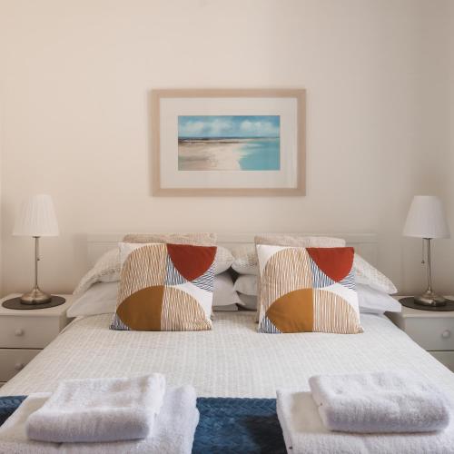a bedroom with a bed with two pillows at Apartment - Sleeps 4 Pet friendly & Free parking in Anstruther