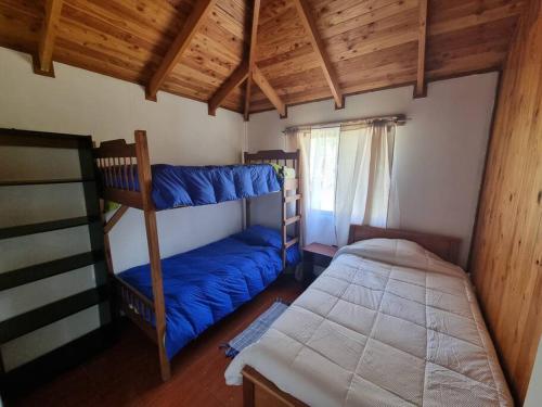 Кровать или кровати в номере Casa ñancul, villarrica