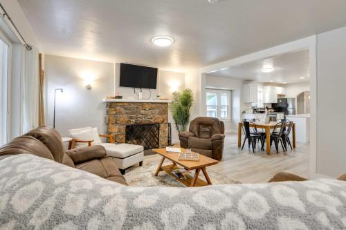 a living room with a couch and a fireplace at 6 Mi to Shoshone Falls Park Home with Game Room! in Twin Falls