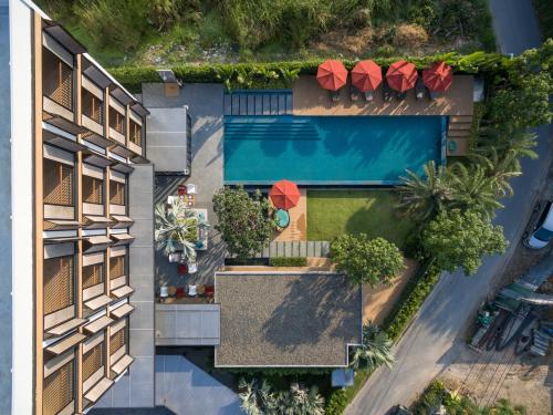 an aerial view of a building with a swimming pool at The Silver Palm Wellness Resort in Bangkok