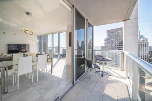a kitchen and dining room with a view of the city at Luxury Ocean View 2BR Corner Unit at W residence in Miami
