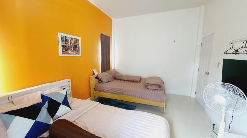 Postel nebo postele na pokoji v ubytování Happy Pool Villa Huahin