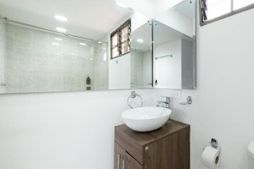 a bathroom with a sink and a mirror at Hotel Chalet La Sofia by Majuva in Armenia