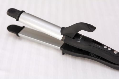 a black and silver tool on a white surface at Hotel JIN Morioka Ekimae in Morioka
