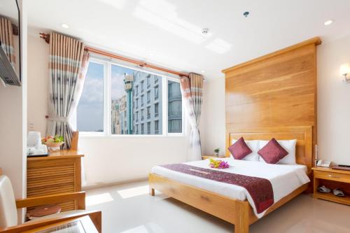 Postel nebo postele na pokoji v ubytování Thien Hai Hotel