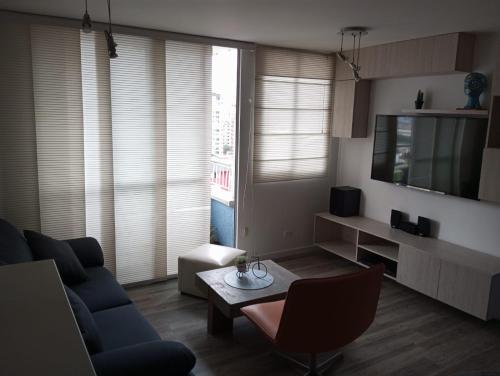 Et tv og/eller underholdning på Magnífico apartamento