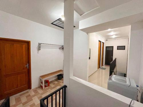 a bathroom with a toilet in a room at Villa FiFa in Blimbing