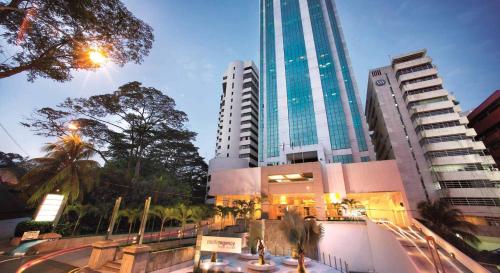 a city with tall buildings and a street with trees at Pacific Regency Hotel Suites in Kuala Lumpur