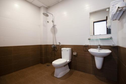Koupelna v ubytování Khách sạn Dệt