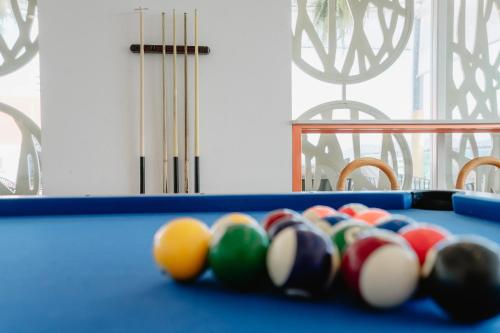a blue pool table with a group of balls on it at SLEEP WITH ME HOTEL design hotel @ patong (SHA Plus+) in Patong Beach