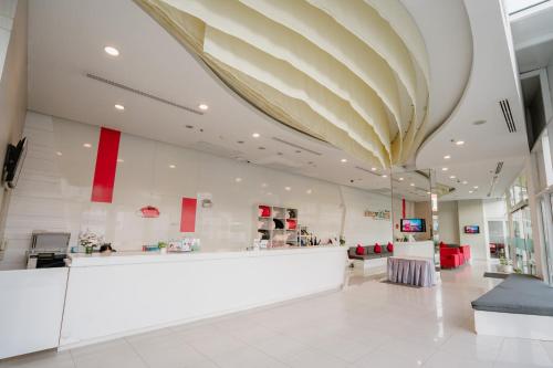 a store lobby with a large ceiling at SLEEP WITH ME HOTEL design hotel @ patong (SHA Plus+) in Patong Beach