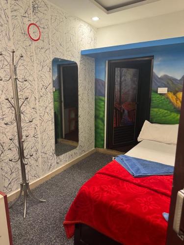 a bedroom with a bed and two mirrors at ARABIAN HOLIDAY RESORT WITH SWIMMING POOL IN IDUKKI Calvary Mount in Idukki