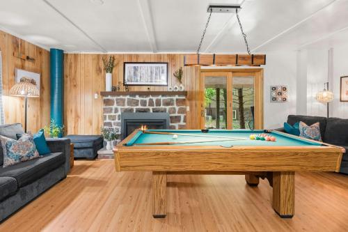 a living room with a pool table at Summit Shores Tranquil Escape Designed for Groups w Fire Pit Game Room in Lake Harmony