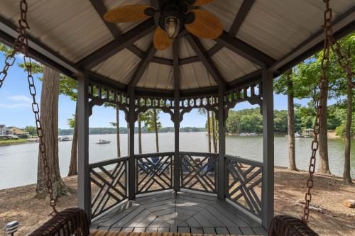 a gazebo with a view of the water at Paradise Pointe by AvantStay Lakefront Views Playset in Lake Norman of Catawba