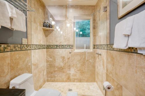 a bathroom with a toilet and a shower at Manitou River House 113 by AvantStay A Location in Telluride