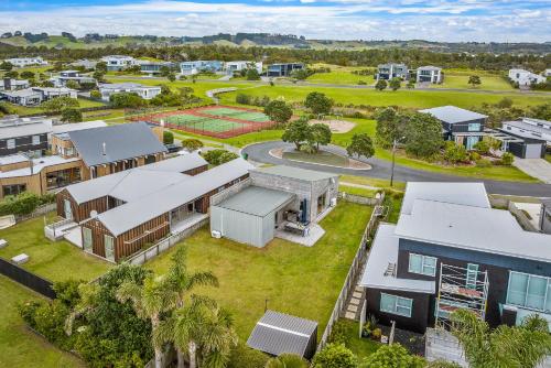 an aerial view of a house in a suburb at The Weekender - Omaha Holiday Home in Warkworth
