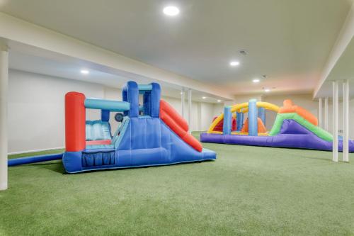 a play room with three slides in it at Game Farm Villa by AvantStay 10BDR Private Pond Spa Pool Family-Friendly in Catskill