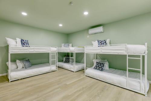 a room with three bunk beds in it at Game Farm Villa by AvantStay 10BDR Private Pond Spa Pool Family-Friendly in Catskill