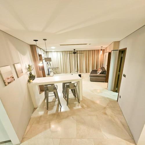 a kitchen and living room with a table and chairs at Vortex klcc by hr in Kuala Lumpur