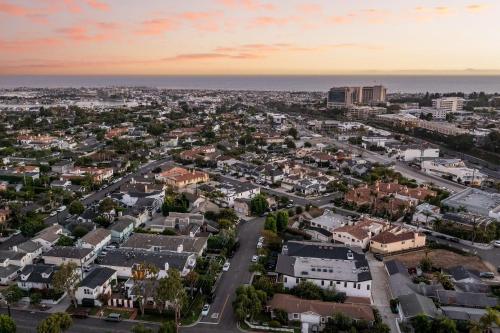 an aerial view of a city at sunset at Emerald Cove by AvantStay Mins to Beach Pier in Newport Beach