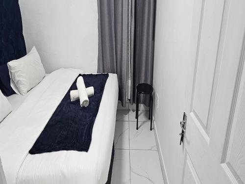 Ένα ή περισσότερα κρεβάτια σε δωμάτιο στο Goshen Lodge Fitzroy