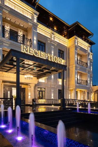 a large building with a sign that reads integration at Bogishamol Hotel in Samarkand