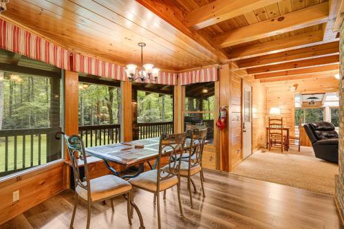 a dining room with a table and chairs at Twin Creeks Lodge by AvantStay 33 Acre Retreat in Brevard