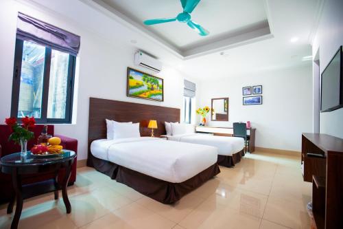 Postel nebo postele na pokoji v ubytování Hanoi Shining House