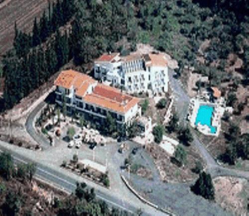 an aerial view of a large building with a pool at Tselikas Hotel in Kozani