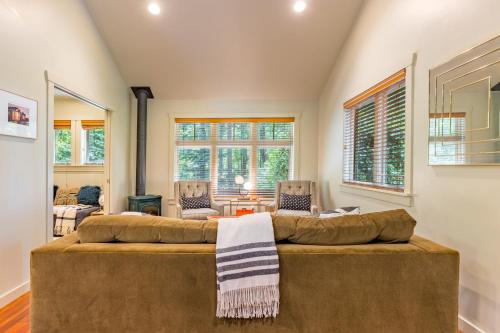 a living room with a large brown couch at The Cottage at Herons Roost by AvantStay in Langley