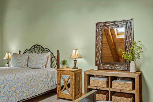 a bedroom with a bed and a mirror at The Bigwood Cabin by AvantStay Hot Tub Firepit Pool Table Private Yard in Long Pond