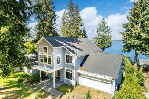 an aerial view of a white house with trees at Langley by the Sea by AvantStay Panoramic Vistas in Langley
