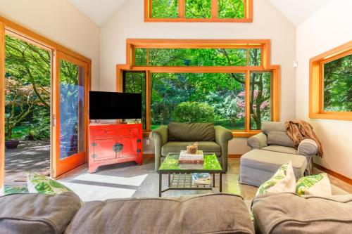 a living room with two couches and a tv at Rhythm Waters by AvantStay Garden Paradise Pond in Langley