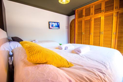 a bedroom with a bed with two babies laying on it at 16:9 Los Molinos Suites in Almería