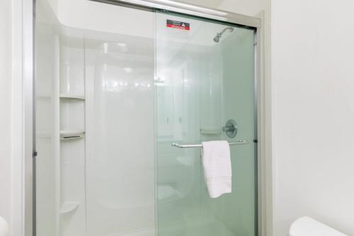 a shower with a glass door in a bathroom at Saratoga by the Sea by AvantStay Panoramic View Near Langley in Langley