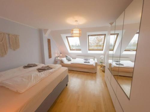 Postelja oz. postelje v sobi nastanitve CASARiNA - Über den Dächern Leipzigs