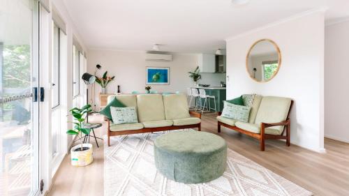 a living room with a couch and a table at The Holiday Shack at Flinders in Flinders