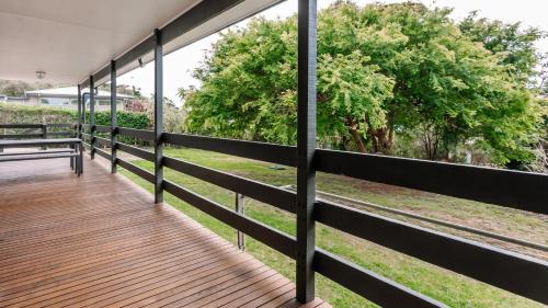 a wooden deck with a view of a park at The Holiday Shack at Flinders in Flinders