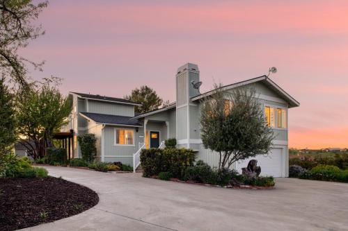 a house with a driveway in front of it at Hilltop by AvantStay Countryside Escape w Views in Paso Robles