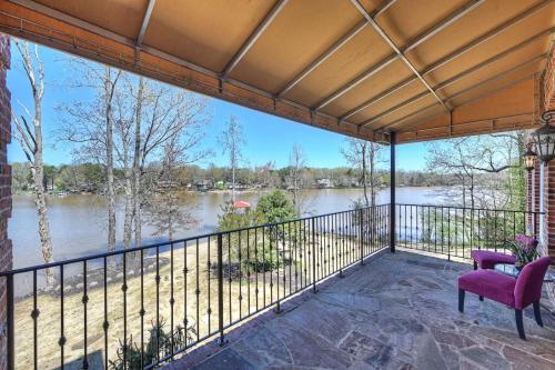 a balcony with a view of a river at Flip Flop Therapy by AvantStay Lakefront Home w Game Room Dock Access in Mooresville