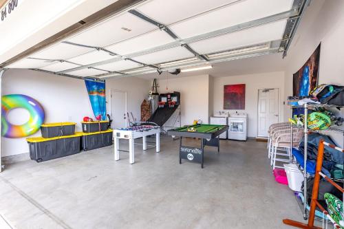 a living room with a ping pong table in it at Makaha Villa by AvantStay Mountain Ocean Views in Waianae