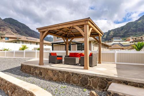 a gazebo with a couch and chairs on a patio at Makaha Villa by AvantStay Mountain Ocean Views in Waianae