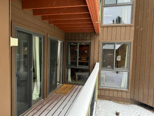a porch of a house with glass doors andwindows at The Forest Neighborhood by Keystone Resort in Keystone