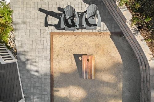 a door in a brick wall with a sign at Hidden Oaks Farmhouse by AvantStay Hot Tub Deck in Atascadero