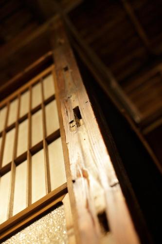 a close up of a wooden door with a window at Bamba Hotel Tokyo-Private Townhouse- in Tokyo