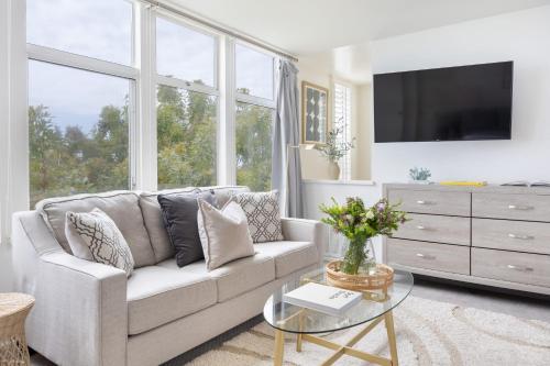 a living room with a couch and a tv at Stardust by AvantStay Views Hot Tub Pool Table in Malibu